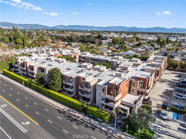 an aerial view of residential building with city view