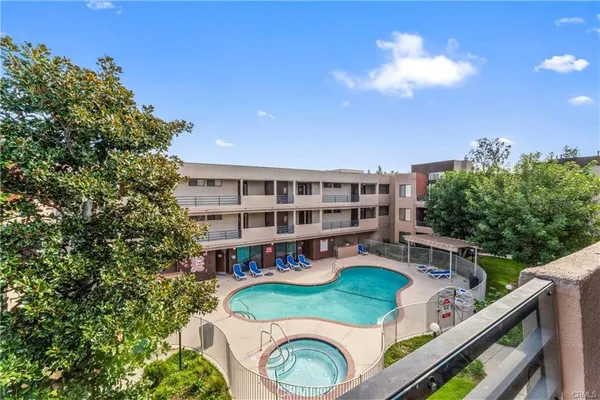 a view of a balcony with chairs