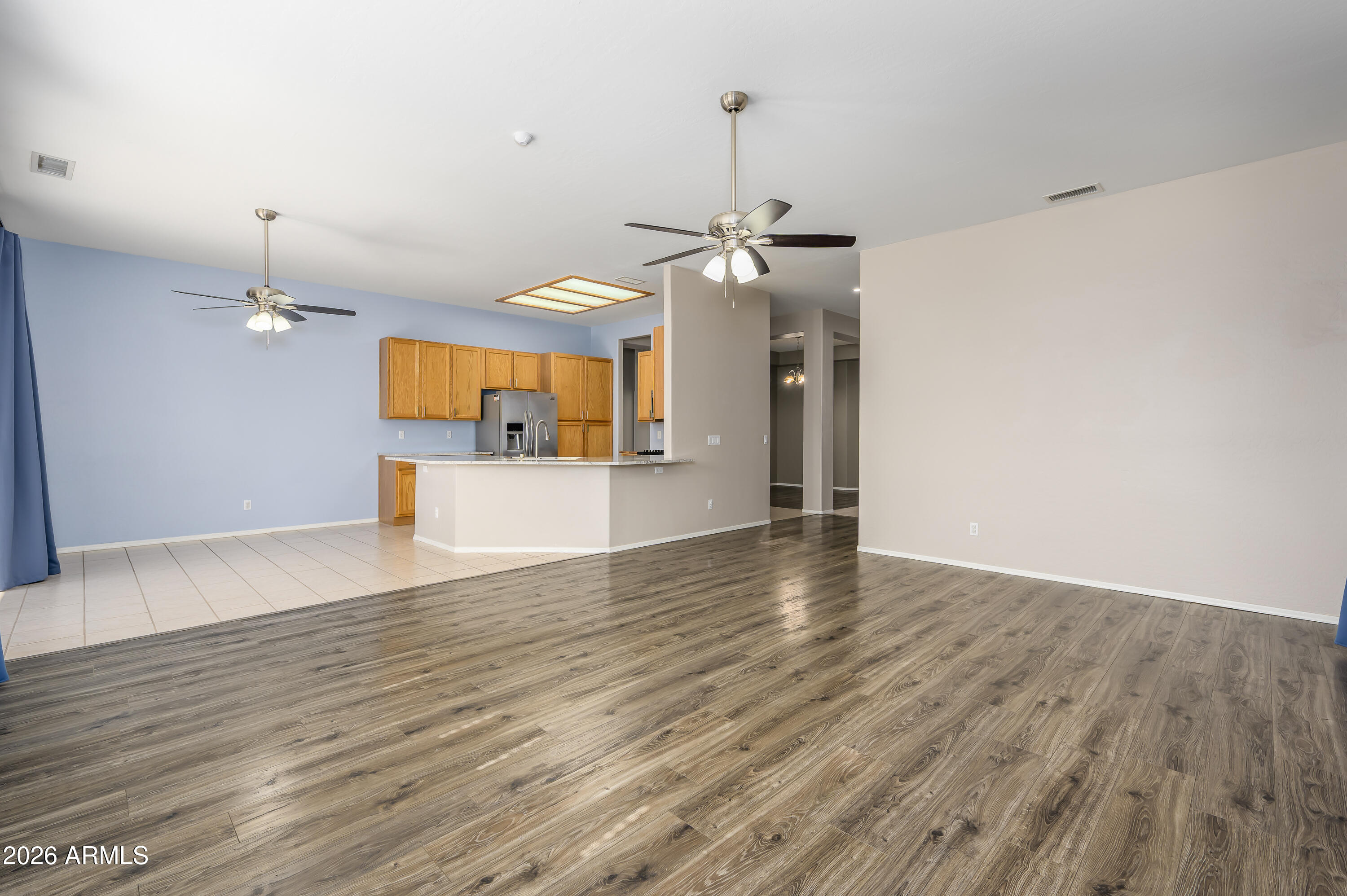11195 West Alvarado Road Avondale, AZ 85392 - Photo 3 of 31 Living Room/Dining/Kitchen