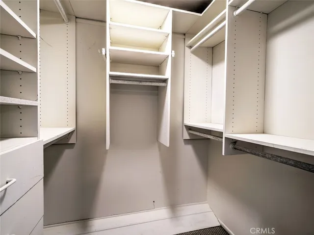 a bathroom with a double vanity sink a mirror and shower