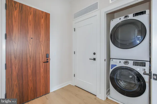 a view of a hallway with washer and dryer