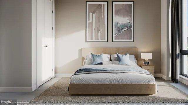 a living room with furniture kitchen view and a window