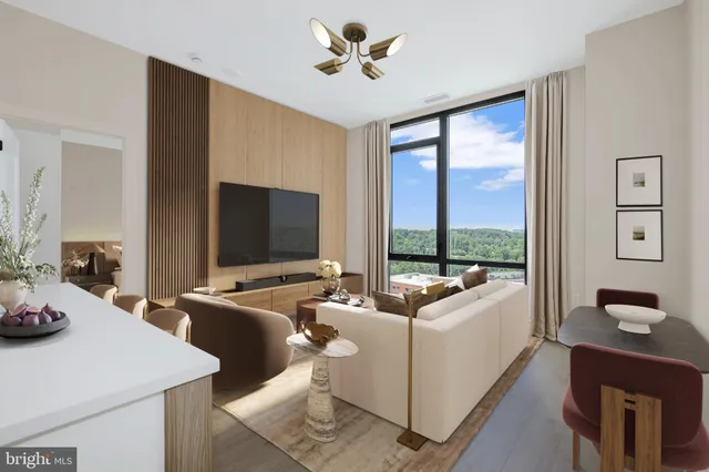 a large room with a large window and furniture