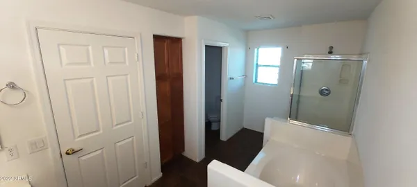 a view of a hallway with seating area