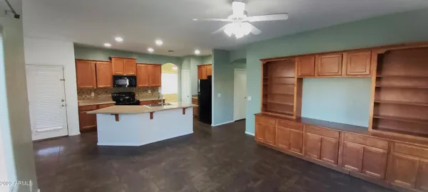 a view of a hallway with entryway and kitchen