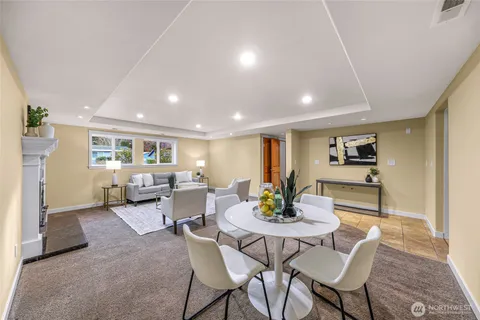 a dining room with furniture and window