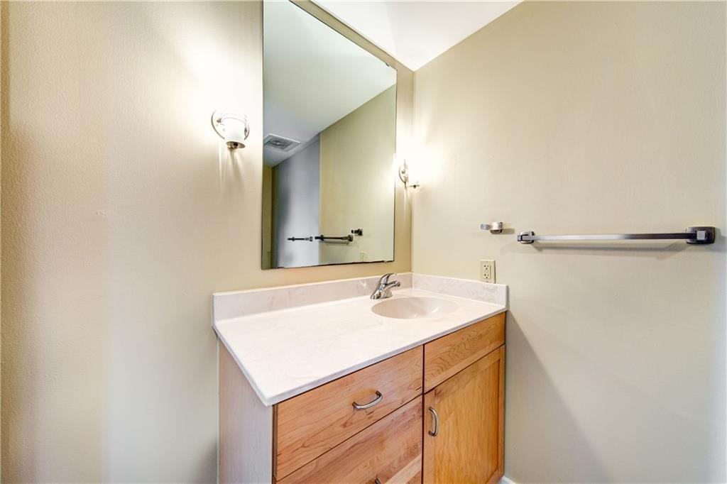 711 West 26th Street, Unit 506 Austin, TX 78705 - Photo 13 of 16 a bathroom with a sink and a mirror