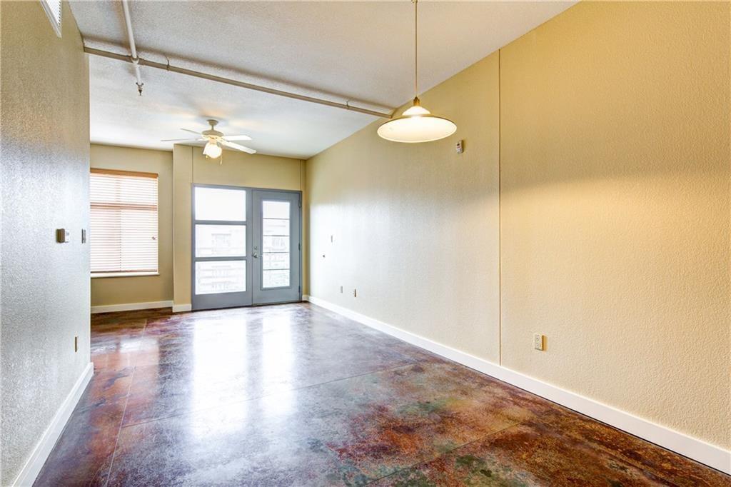711 West 26th Street, Unit 506 Austin, TX 78705 - Photo 2 of 16 a view of an empty room with a window and wooden floor