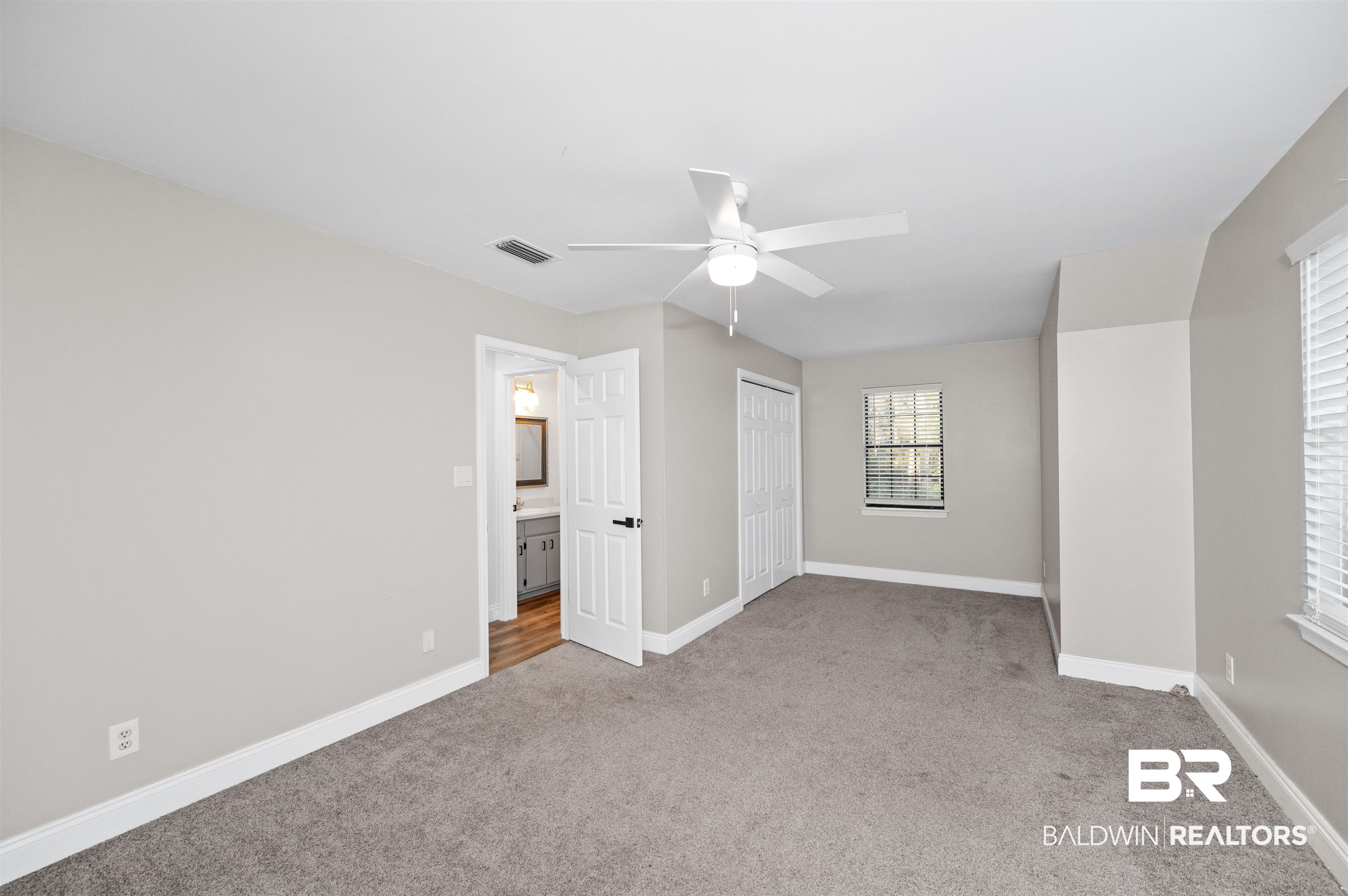 19274 Rada Road Silverhill, AL 36576 - Photo 13 of 18 ceiling fan, double closet, and light colored carpet