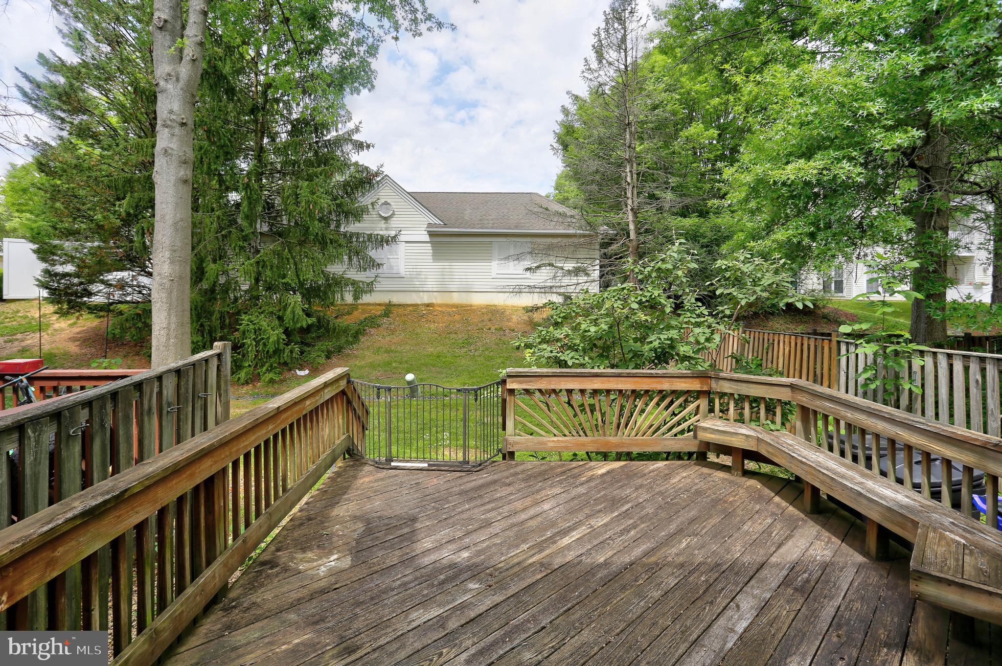 6136 Starburn Path Columbia, MD 21045 - Photo 25 of 35 a view of balcony with wooden floor and fence