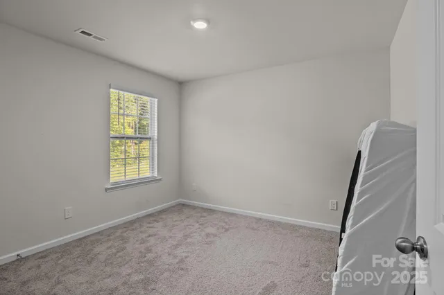 a view of a room with windows