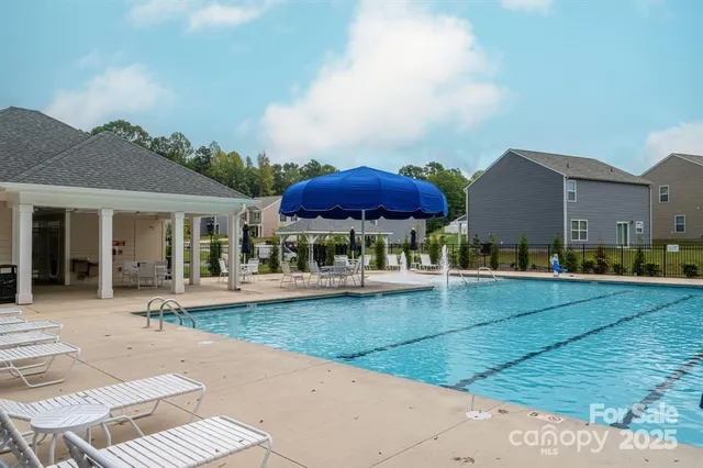 a view of a house with sitting area and furniture