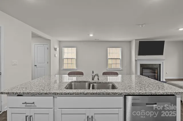 a kitchen with granite countertop a sink and a granite counter tops
