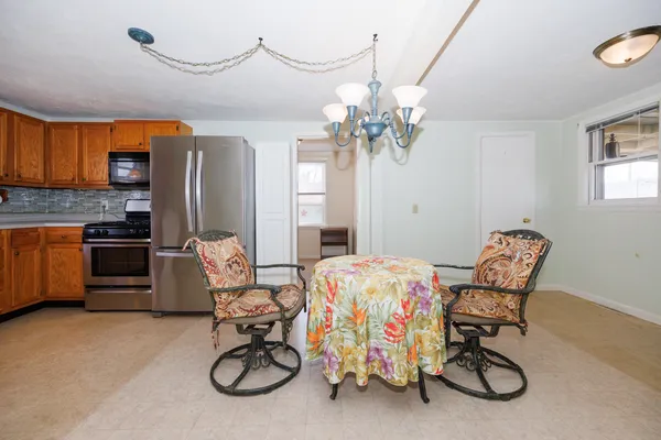 a bedroom with furniture and a chandelier