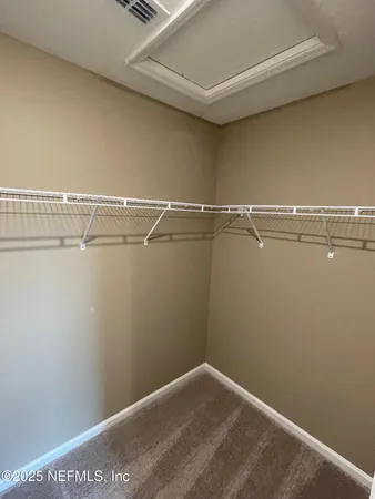 a view of a room with racks on the wall