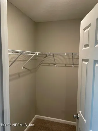 a view of small space with racks on the wall