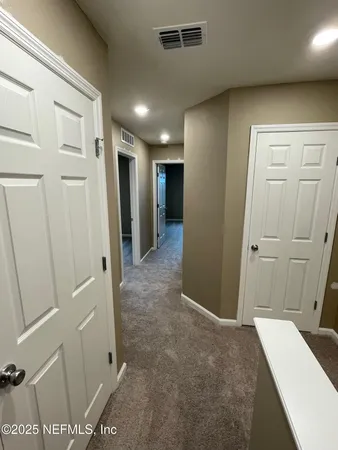 a view of a hallway with closet area