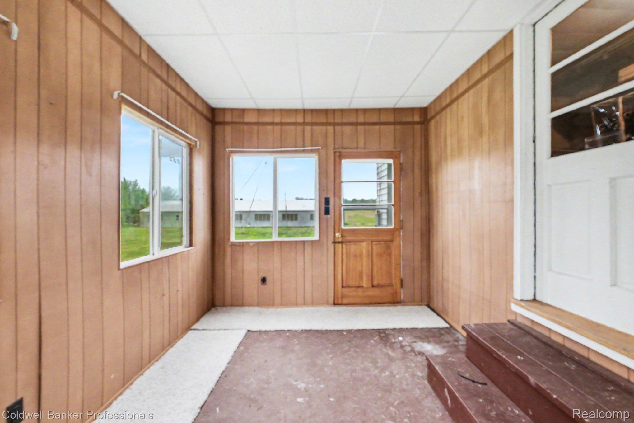 3105 East Dodge Road Clio, MI 48420 - Photo 18 of 28 View of unfurnished sunroom