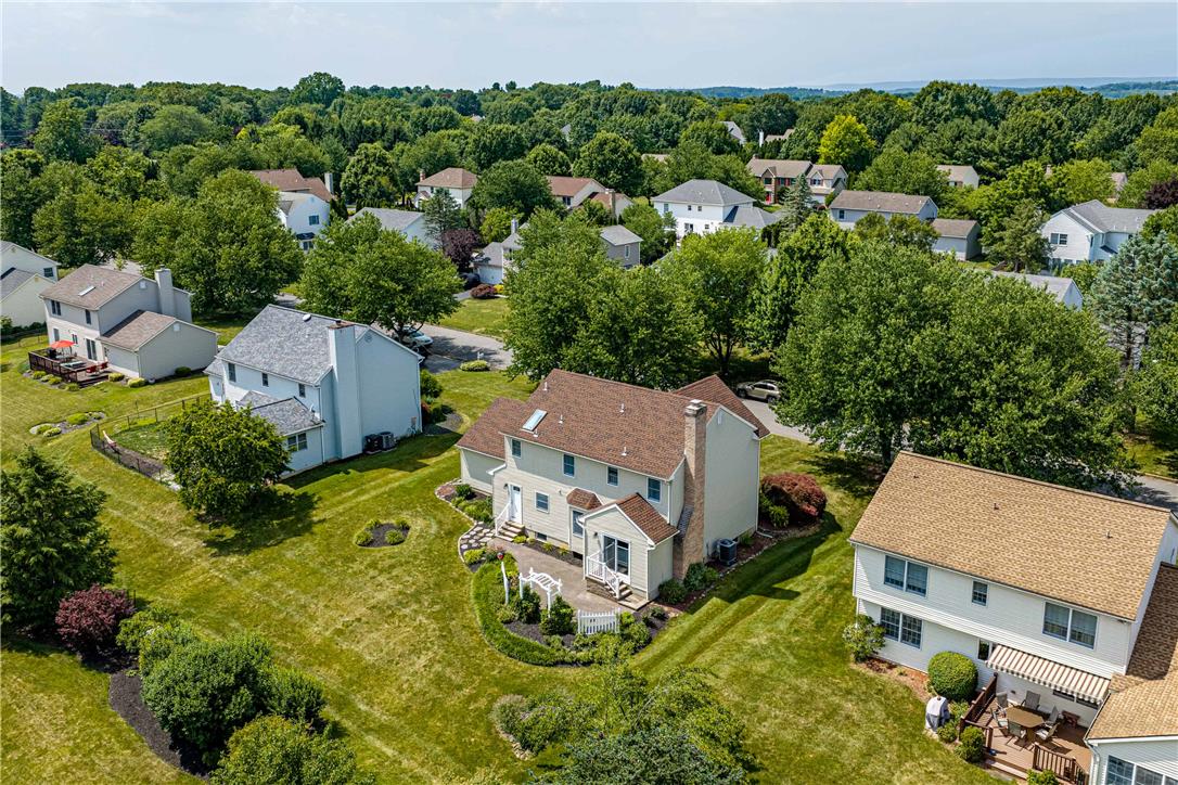 4568 Greenfield Road Bethlehem, PA 18017 - Photo 53 of 59 An aerial perspective reveals a harmonious neighborhood nestled among verdant trees and well-kept lawns.