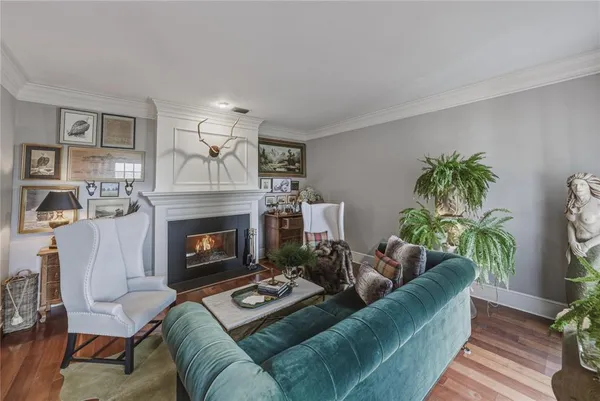 a view of fireplace with wooden floor