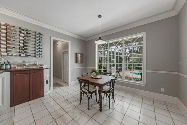 a bathroom with a granite countertop sink a mirror a shower and a bathtub