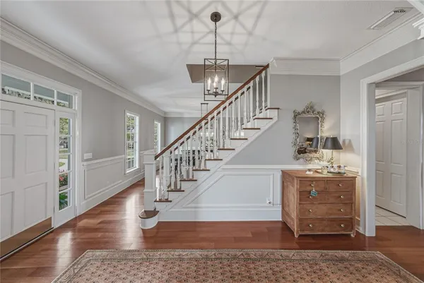a view of a livingroom with furniture and workspace