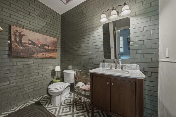 a view of a house with backyard porch and sitting area