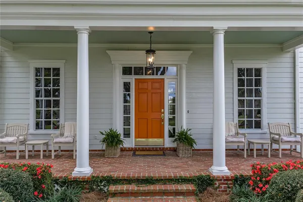 a living room with furniture fireplace and window