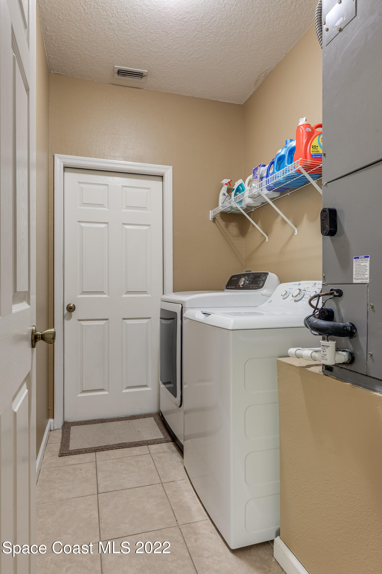 1114 Sexton Road Southwest Palm Bay, FL 32908 - Photo 13 of 19 a room with storage and utility