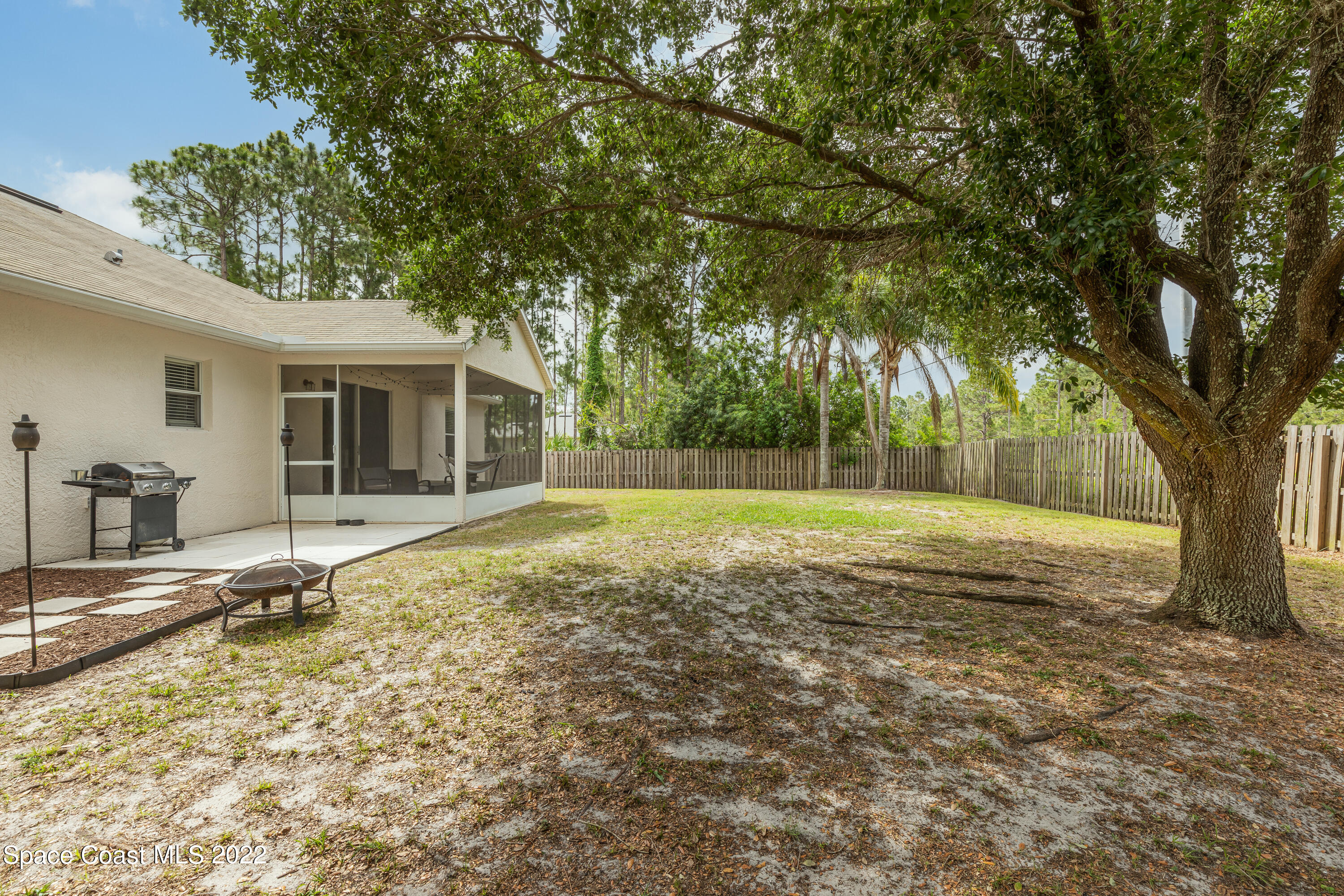 1114 Sexton Road Southwest Palm Bay, FL 32908 - Photo 18 of 19 a view of a house with a yard
