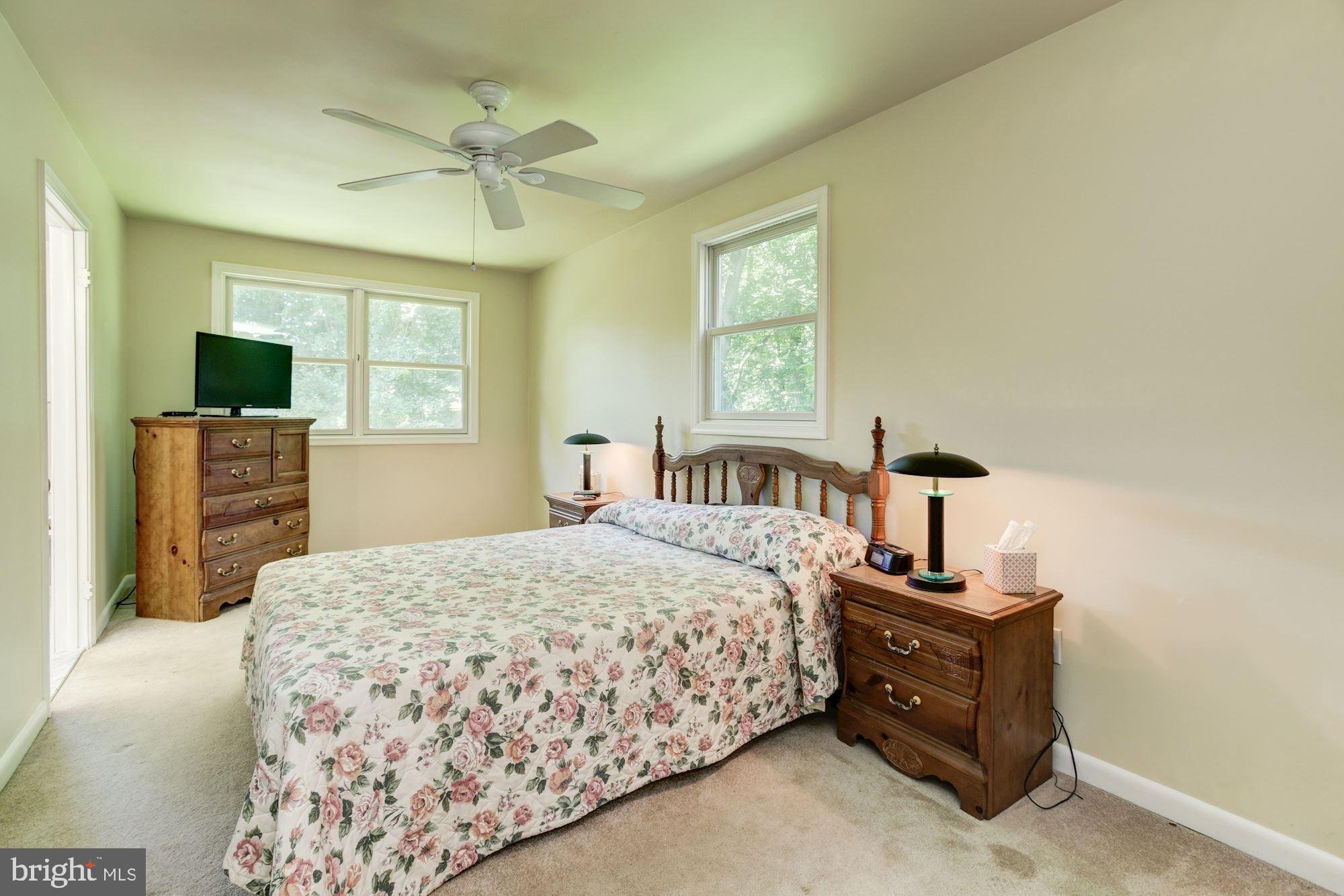 2800 Ridge Road Windsor Mill, MD 21244 - Photo 16 of 37 a bedroom with a bed and a flat tv screen on dresser