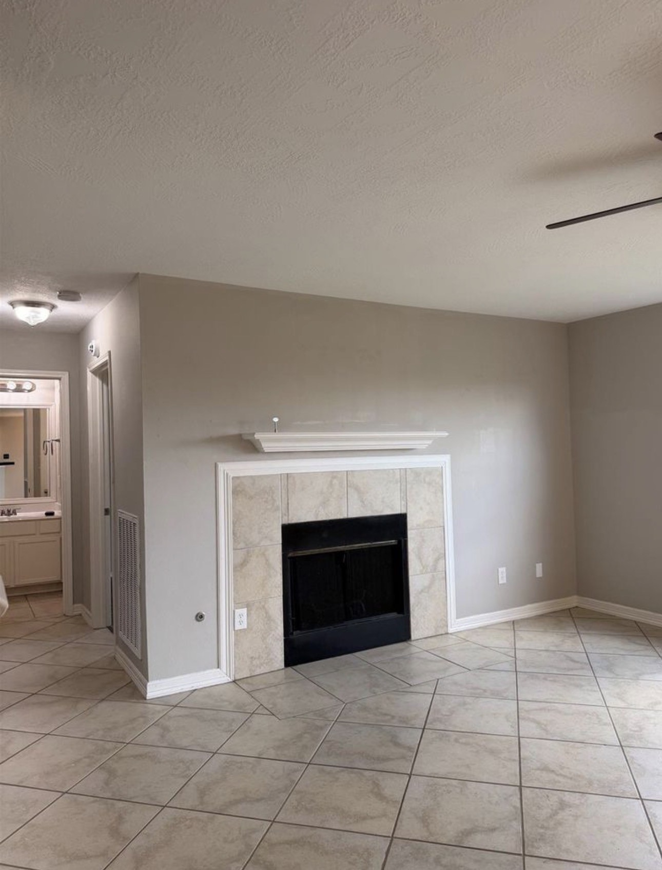 4707 East Parma Drive Rosenberg, TX 77471 - Photo 11 of 22 a view of empty room with a fireplace