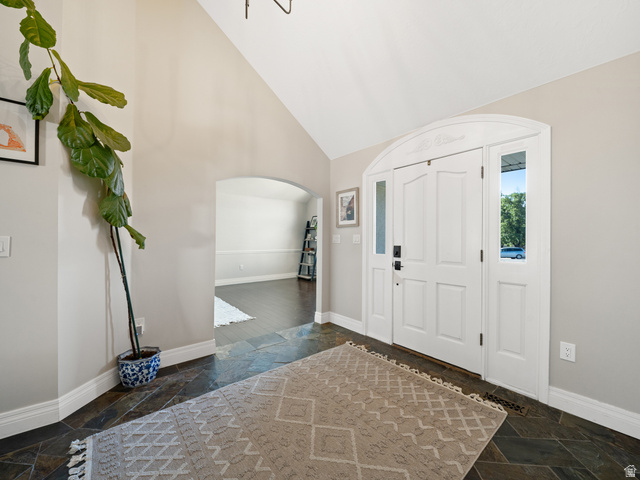 13357 Trail Rider Circle Draper, UT 84020 - Photo 20 of 70 Grand entryway featuring an arched double-door system with sidelights and an upper transom window
