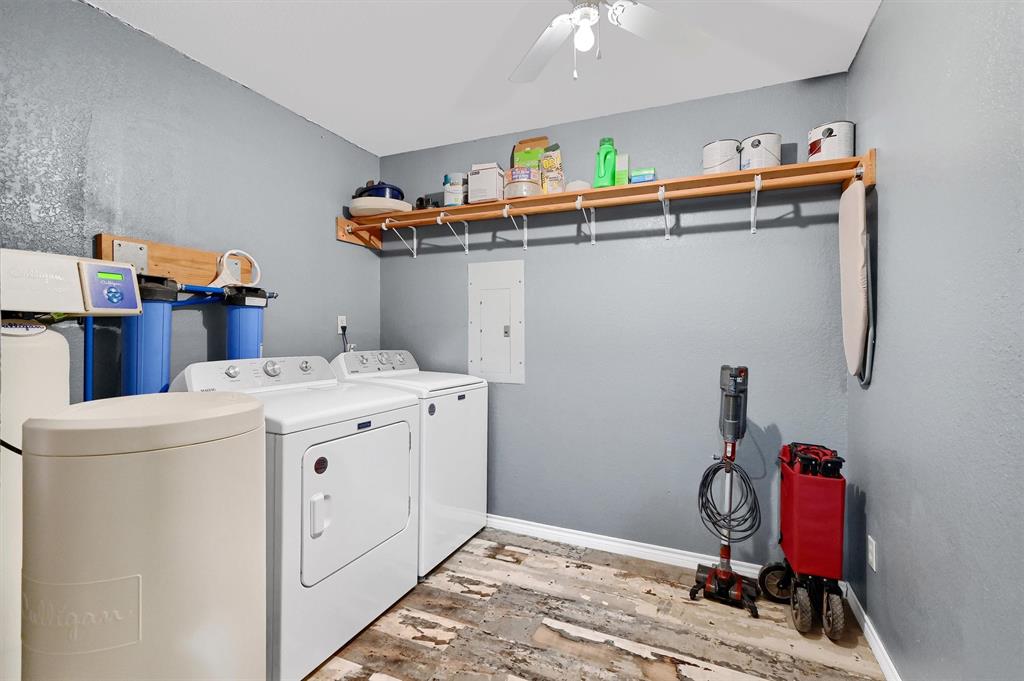 2003 Flowing Wells Road Pottsboro, TX 75076 - Photo 17 of 39 Laundry area featuring ceiling fan, independent washer and dryer, hardwood / wood-style floors, and electric panel