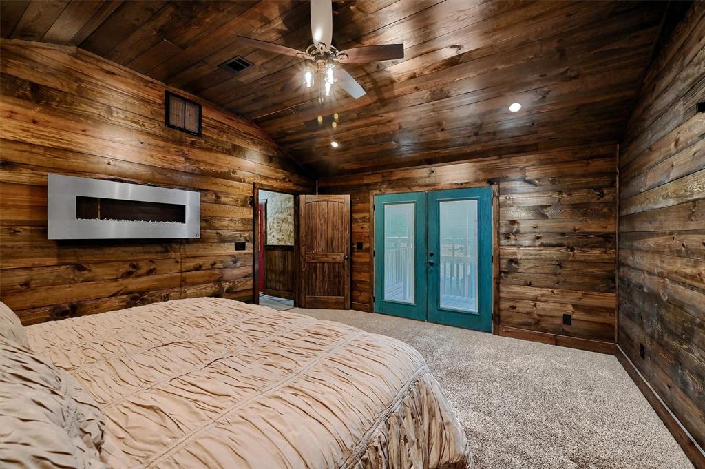 2003 Flowing Wells Road Pottsboro, TX 75076 - Photo 21 of 39 Carpeted bedroom with vaulted ceiling, french doors, wood ceiling, and ceiling fan