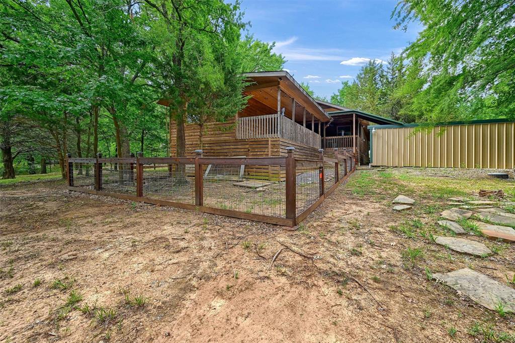 2003 Flowing Wells Road Pottsboro, TX 75076 - Photo 34 of 39 View of yard with an outbuilding