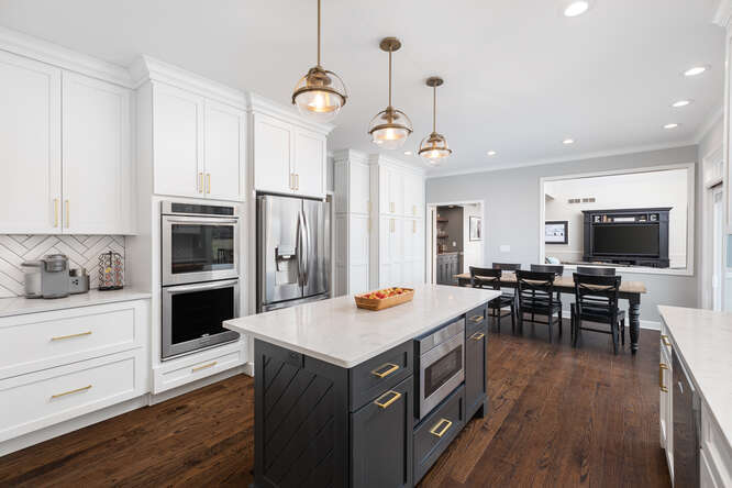 1530 White Eagle Drive Naperville, IL 60564 - Photo 12 of 43 a kitchen with a sink stove and wooden floor