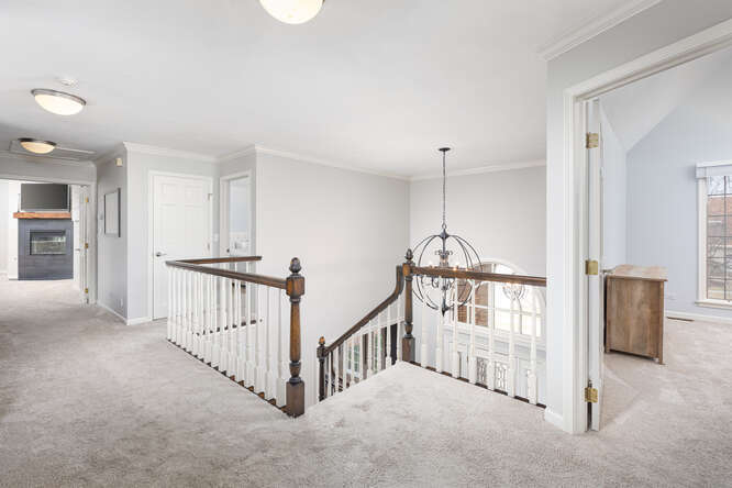 1530 White Eagle Drive Naperville, IL 60564 - Photo 20 of 43 a view of a hallway with windows