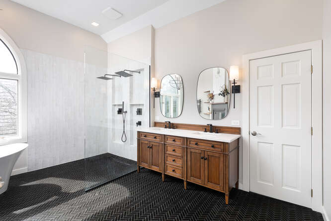 1530 White Eagle Drive Naperville, IL 60564 - Photo 23 of 43 a spacious bathroom with a double vanity sink a mirror and a shower