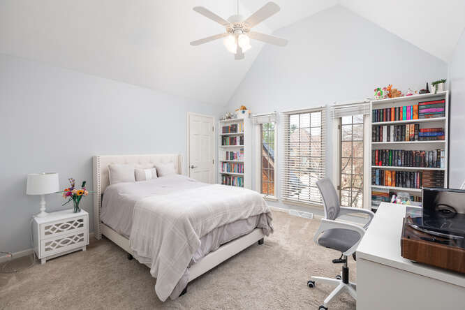 1530 White Eagle Drive Naperville, IL 60564 - Photo 26 of 43 a bed room with a bed and a book shelf