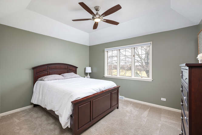 1530 White Eagle Drive Naperville, IL 60564 - Photo 27 of 43 a bedroom with a bed and window