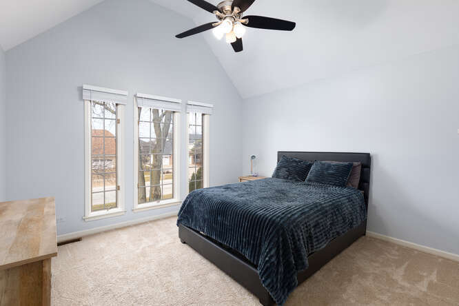 1530 White Eagle Drive Naperville, IL 60564 - Photo 28 of 43 a bedroom with a bed and window