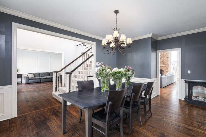 1530 White Eagle Drive Naperville, IL 60564 - Photo 3 of 43 a view of a dining room with furniture and wooden floor