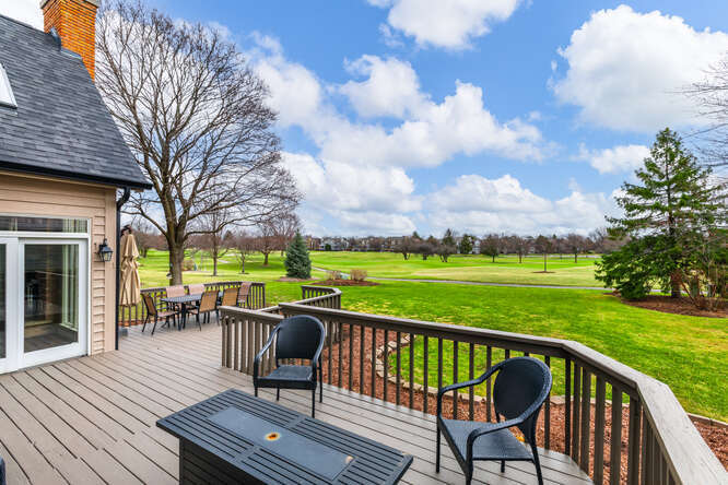 1530 White Eagle Drive Naperville, IL 60564 - Photo 40 of 43 a view of a deck with chairs and a yard