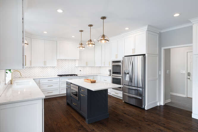 1530 White Eagle Drive Naperville, IL 60564 - Photo 10 of 43 a kitchen with a refrigerator sink and cabinets