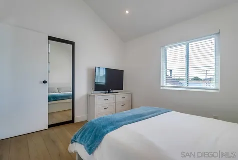 a bedroom with a bed and a table