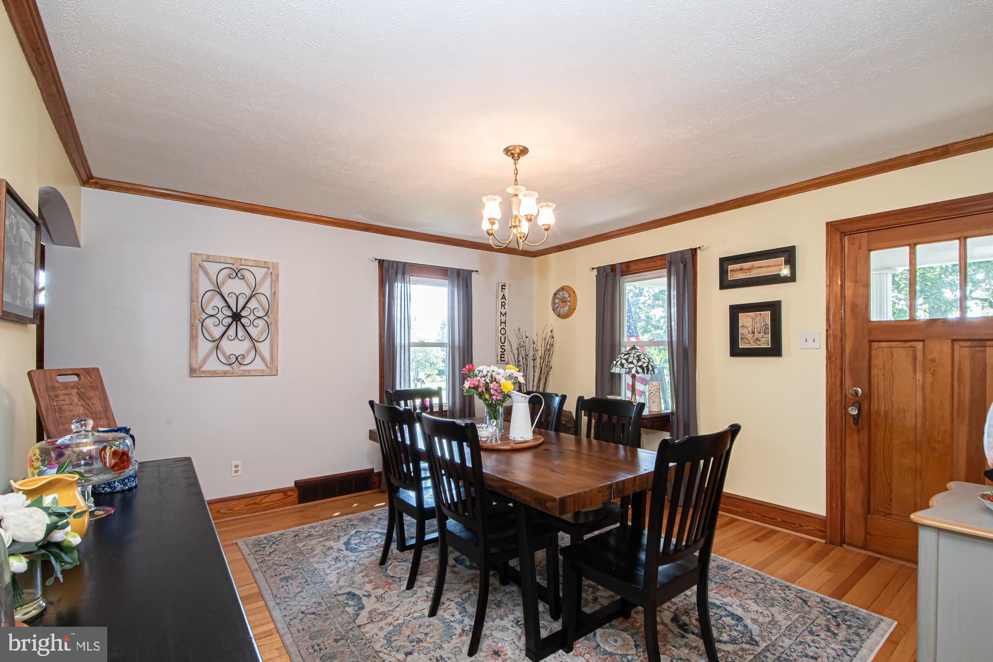 2180 Strasburg Road Front Royal, VA 22630 - Photo 11 of 90 a view of a dining room with furniture and wooden floor