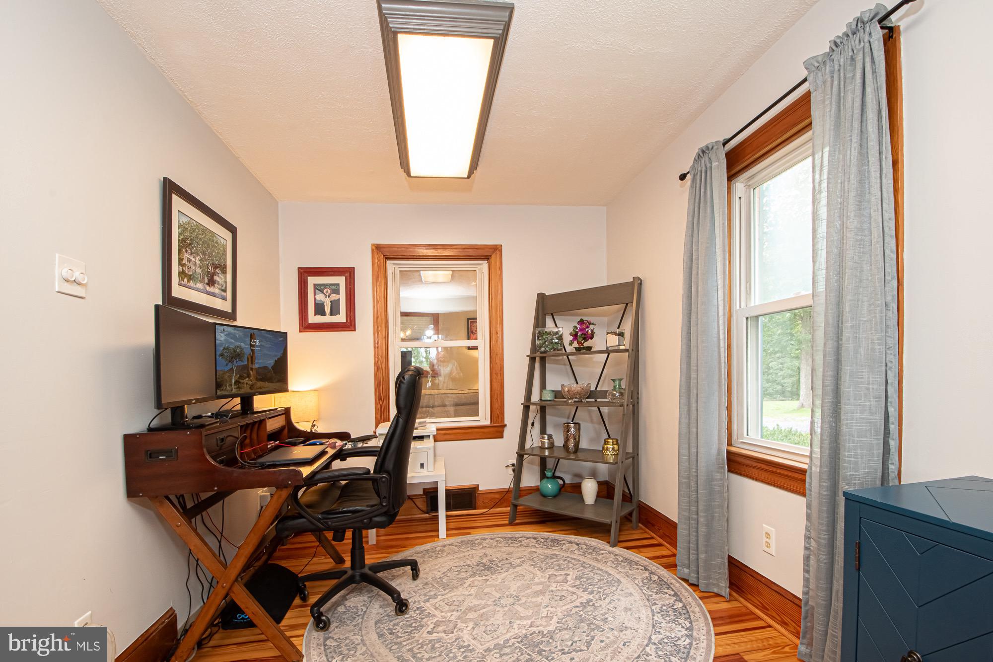 2180 Strasburg Road Front Royal, VA 22630 - Photo 16 of 90 a view of a workspace with furniture and a window