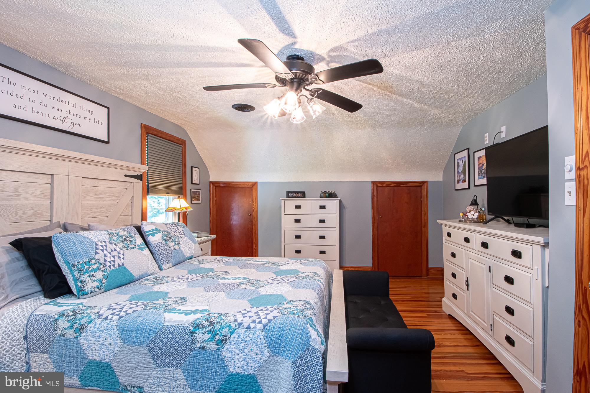2180 Strasburg Road Front Royal, VA 22630 - Photo 19 of 90 a bedroom with a bed and a flat screen tv