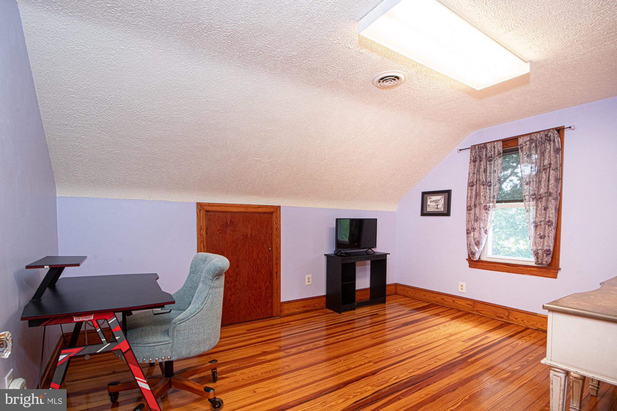 2180 Strasburg Road Front Royal, VA 22630 - Photo 23 of 90 a view of a workspace with furniture and a window